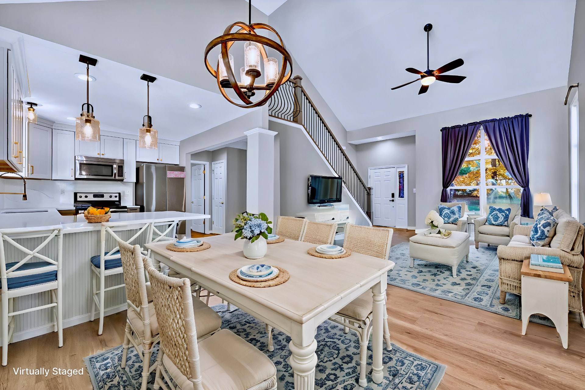 The same dining area virtually staged with a blue and white nautical dining set